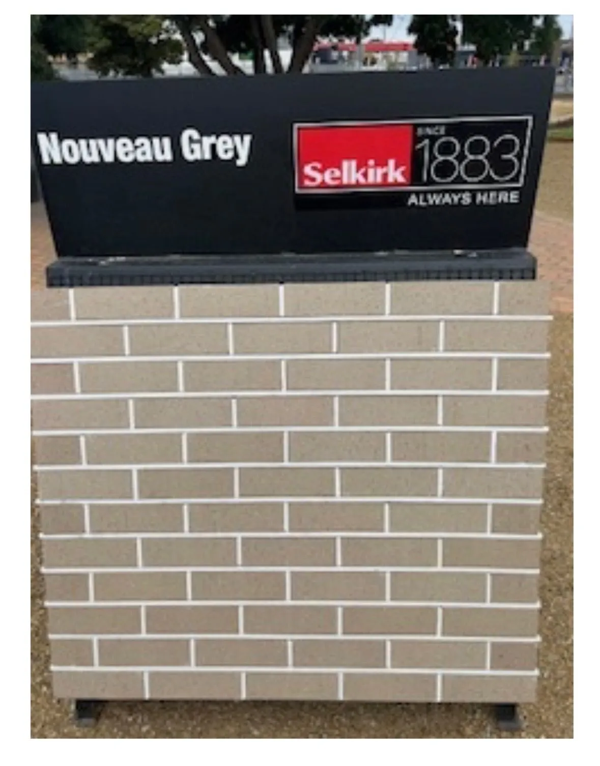 Nouveau Grey blockwork sample shown with a Selkirk sign