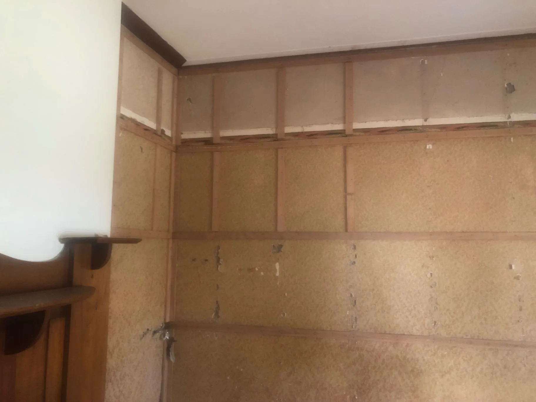 Oakleigh bedroom with original wall lining and timber shelving