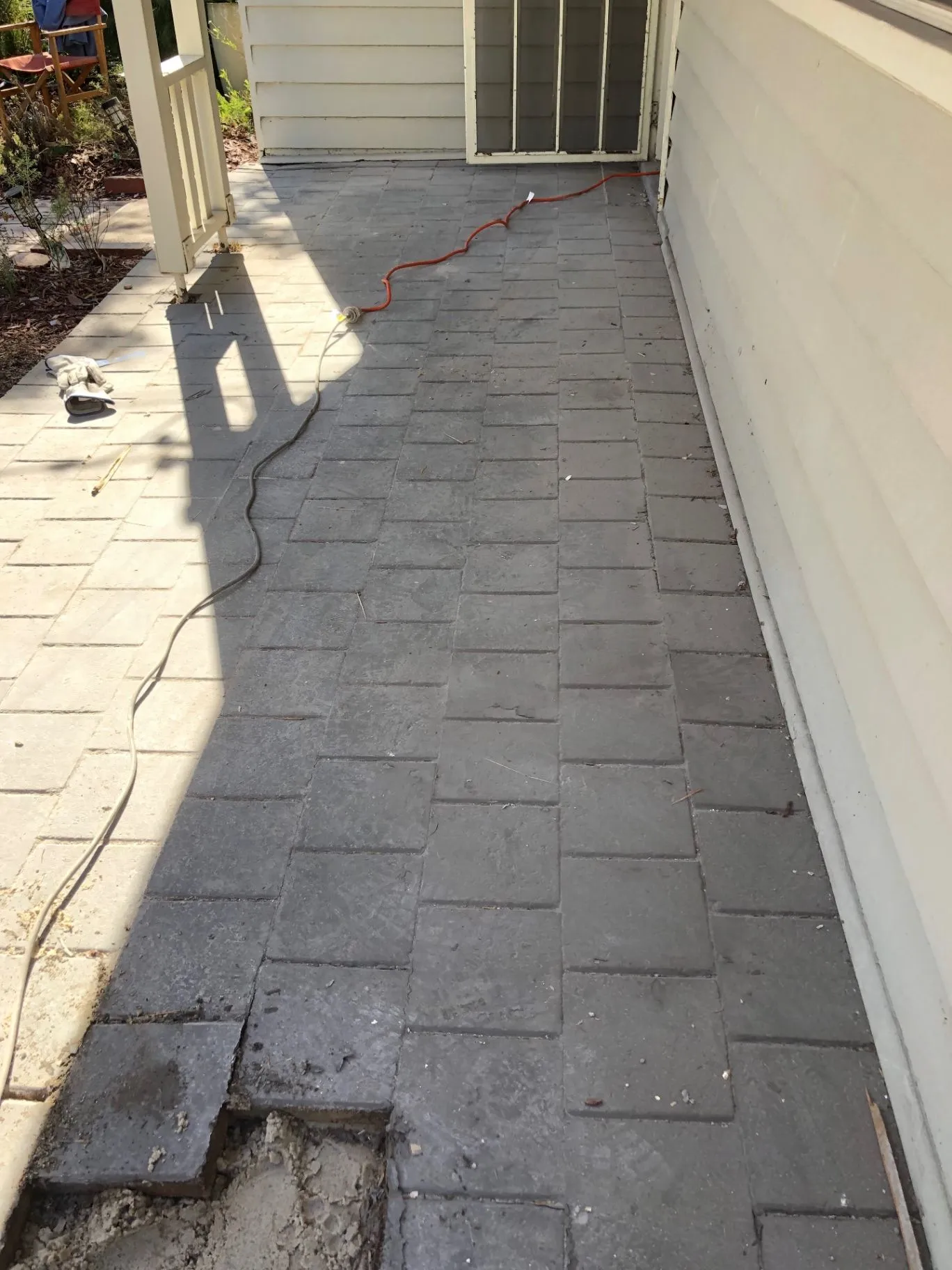 Concrete pavers beside the Oakleigh home before removal